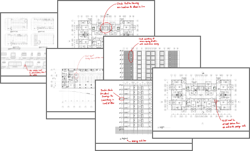 Stack of drawings with handwritten markups